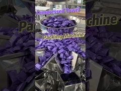 Acht-stations compress handdoek zak-voedende verpakkingsmachine